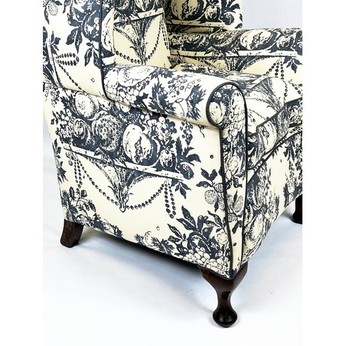 194 - WING ARMCHAIR, 118cm H x 87cm, early 20th century mahogany in cream and grey fruit patterned fabric.