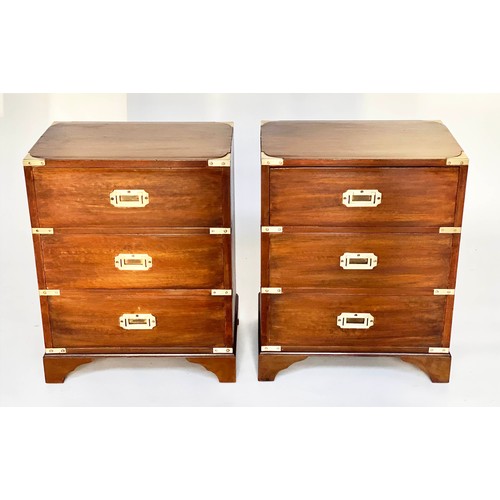 122 - BEDSIDE CHESTS, a pair, campaign style mahogany and brass bound each with three drawers, 47cm x 61cm... 