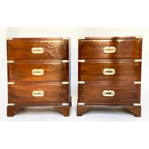 122 - BEDSIDE CHESTS, a pair, campaign style mahogany and brass bound each with three drawers, 47cm x 61cm... 