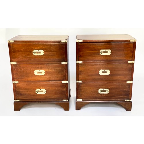 122 - BEDSIDE CHESTS, a pair, campaign style mahogany and brass bound each with three drawers, 47cm x 61cm... 