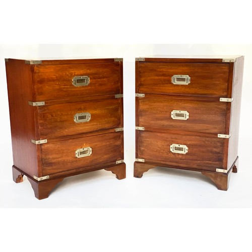 122 - BEDSIDE CHESTS, a pair, campaign style mahogany and brass bound each with three drawers, 47cm x 61cm... 