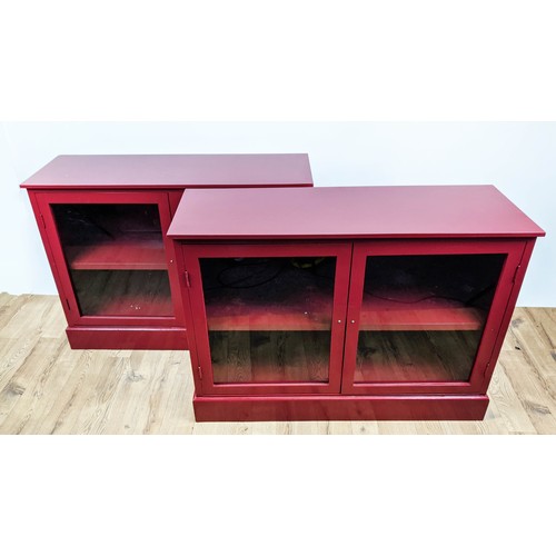 377 - CABINETS, a pair, 103.5cm x 35cm x 74cm, red painted, each with two glazed doors, shelf in each. (2)