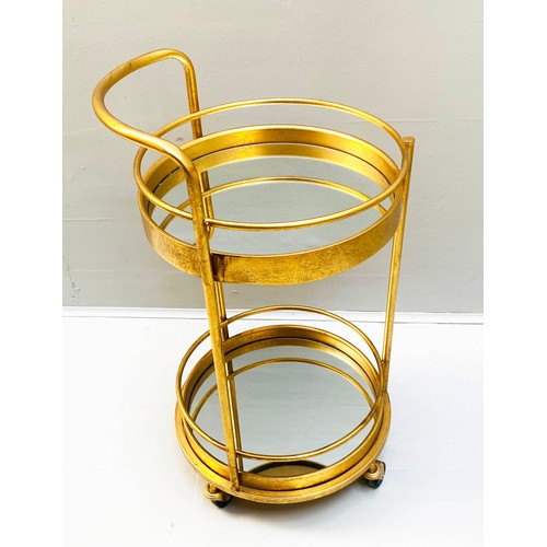 355 - COCKTAIL TROLLEY, 77cm high, 42cm diameter, 1960s French style, mirrored glass tiers, gilt metal fra... 