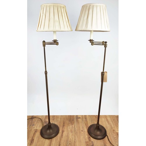 437 - READING FLOOR LAMPS, 150cm high, 40cm wide, a pair, swing arm design, gilt metal with pleated shades... 