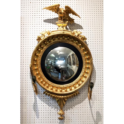 256 - CONVEX GIRANDOLE, 90cm H x 48cm, Regency giltwood with eagle surmount and a pair of candle sconces.