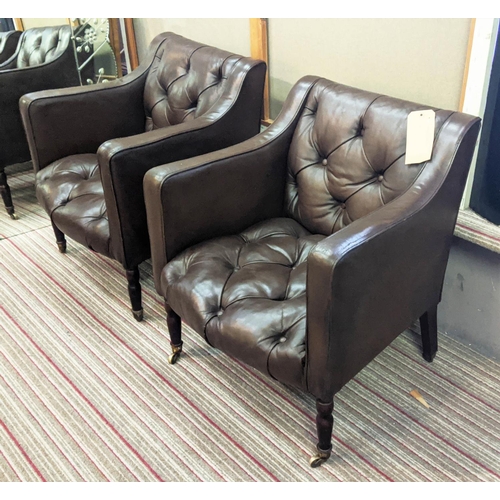 254 - CLUB ARMCHAIRS, a pair, each 65cm W x 75cm H, in buttoned brown leather on turned supports, Provenan... 