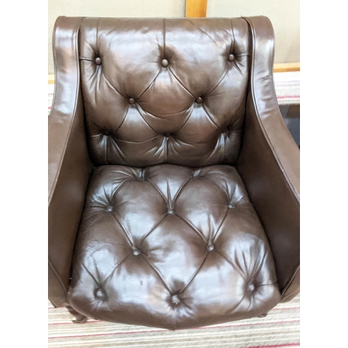 254 - CLUB ARMCHAIRS, a pair, each 65cm W x 75cm H, in buttoned brown leather on turned supports, Provenan... 