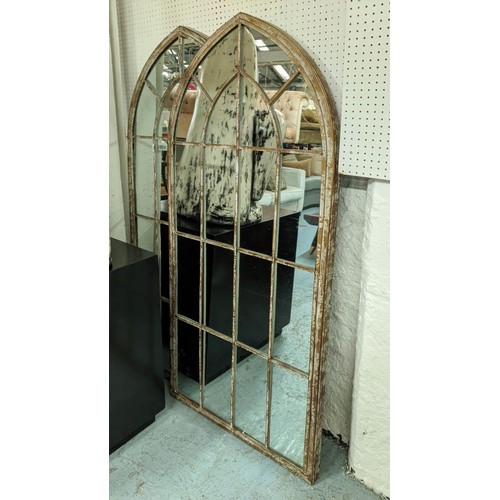 447 - ARCHITECTURAL GARDEN WALL MIRRORS, a pair, aged metal frames, 158cm x 67cm. (2)