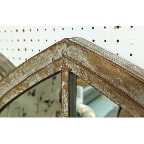 447 - ARCHITECTURAL GARDEN WALL MIRRORS, a pair, aged metal frames, 158cm x 67cm. (2)