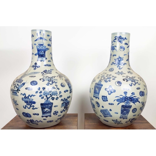 27 - BOTTLE VASES, 58cm high, a pair, Chinese Export style blue and white ceramic. (2)