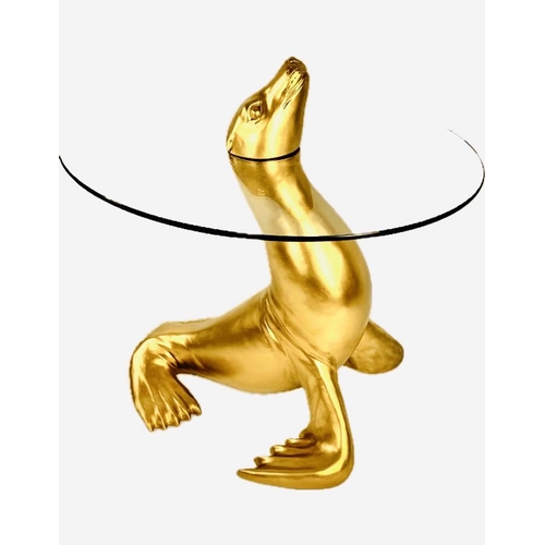 336 - SIDE TABLE, in the form of a seal emerging from water, glass top with gilt resin seal figural suppor... 