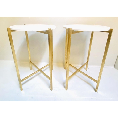 331 - SIDE TABLES, a pair, 63cm high, 44cm diameter, white stone finish inset tops, folding gilt metal bas... 