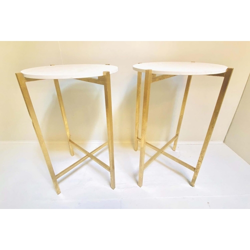 331 - SIDE TABLES, a pair, 63cm high, 44cm diameter, white stone finish inset tops, folding gilt metal bas... 