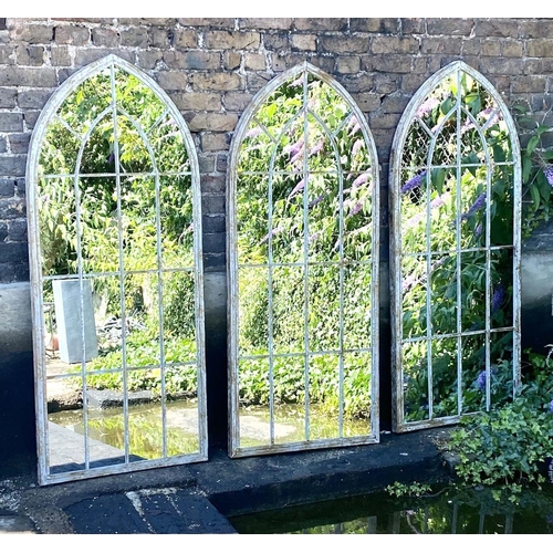 323 - ARCHITECTURAL GARDEN MIRRORS, set of three, 160cm high, 67cm wide, Gothic style with overlaid glazin... 