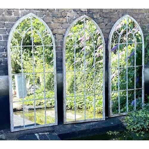 323 - ARCHITECTURAL GARDEN MIRRORS, set of three, 160cm high, 67cm wide, Gothic style with overlaid glazin... 