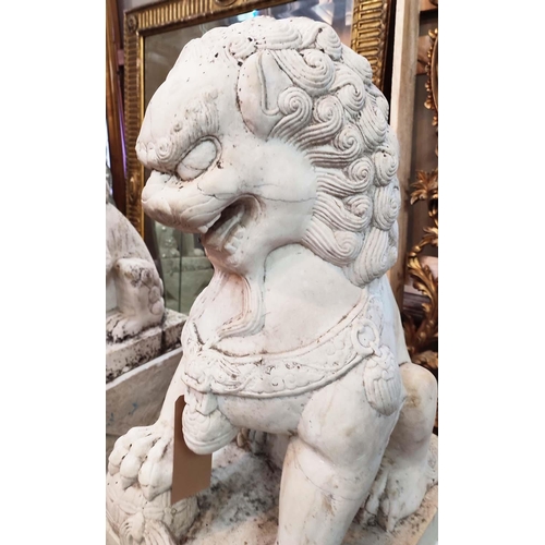 23 - MARBLE GARDEN FOO LIONS, a pair, early 20th century on plinths, 102cm H x 58cm D x 45cm W. (2)