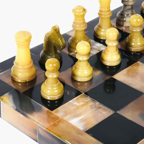 359 - CHESS SET, faux tortoiseshell finish to board, 31cm x 31cm.