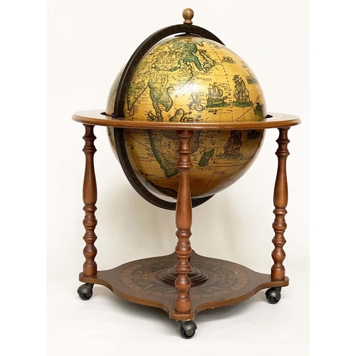 279 - GLOBE COCKTAIL CABINET, in the form of an antique terrestrial globe on stand with rising lid and fit... 