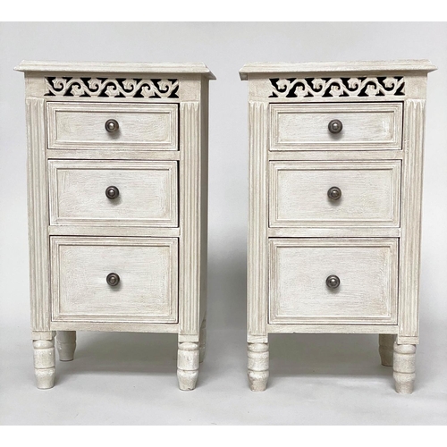 114 - BEDSIDE CHESTS, a pair, French style grey painted each with three drawers and pierced frieze, 40cm x... 