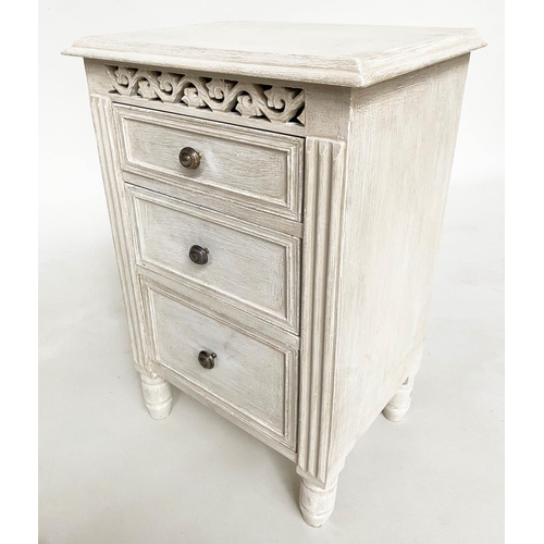 114 - BEDSIDE CHESTS, a pair, French style grey painted each with three drawers and pierced frieze, 40cm x... 