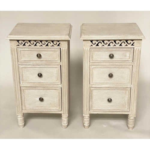 114 - BEDSIDE CHESTS, a pair, French style grey painted each with three drawers and pierced frieze, 40cm x... 