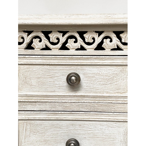 114 - BEDSIDE CHESTS, a pair, French style grey painted each with three drawers and pierced frieze, 40cm x... 