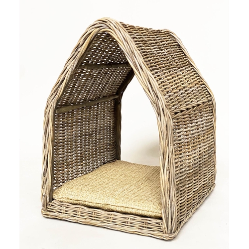 286 - RATTAN DOG BED, woven heavy duty and arched, 72cm x 82cm H x 60cm.