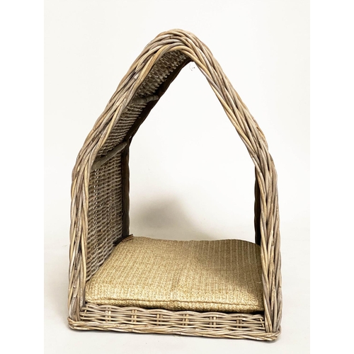 286 - RATTAN DOG BED, woven heavy duty and arched, 72cm x 82cm H x 60cm.