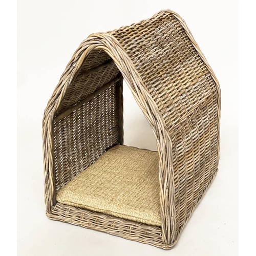 286 - RATTAN DOG BED, woven heavy duty and arched, 72cm x 82cm H x 60cm.