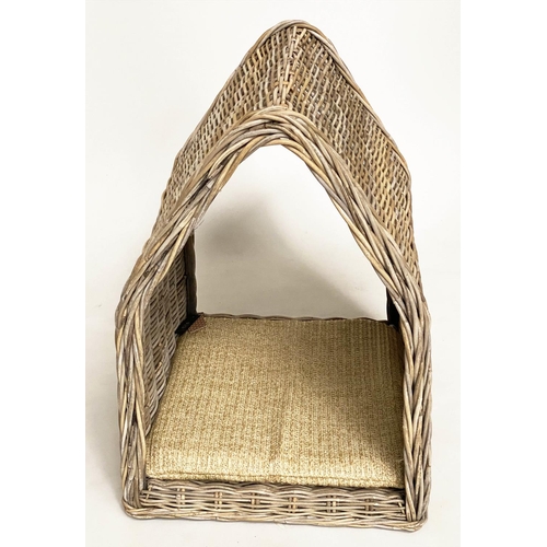 286 - RATTAN DOG BED, woven heavy duty and arched, 72cm x 82cm H x 60cm.