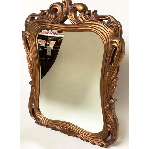 287 - WALL MIRROR, Italian style chantilly gilded deep scrolling frame and shaped bevelled mirror plate, 1... 