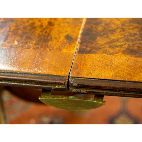 136 - TWIN PEDESTAL DINING TABLE, Regency style burr walnut with extra leaf, brass clips and castors, 76cm... 