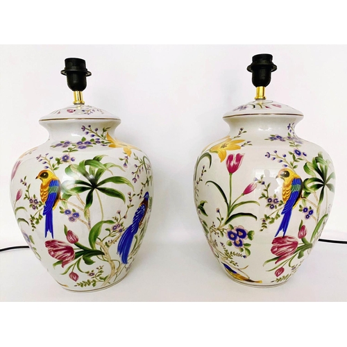 347 - TABLE LAMPS, a pair, 46cm high, 27cm diameter, transfer printed decoration depicting exotic birds am... 