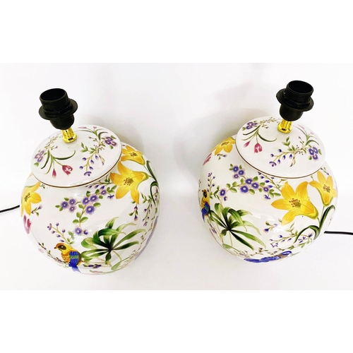 347 - TABLE LAMPS, a pair, 46cm high, 27cm diameter, transfer printed decoration depicting exotic birds am... 