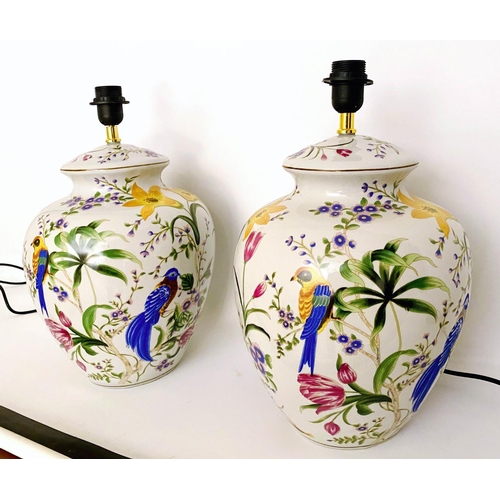 347 - TABLE LAMPS, a pair, 46cm high, 27cm diameter, transfer printed decoration depicting exotic birds am... 