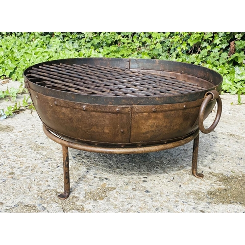 395 - INDIAN STYLE KADAI FIRE PIT, on a stand, oxidised metal, 47cm high, 64cm wide, 60cm diameter.