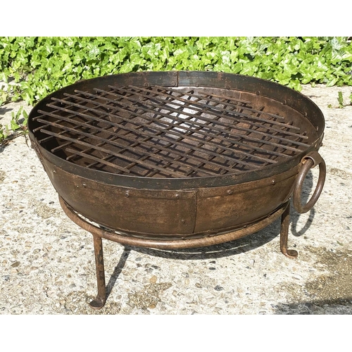 395 - INDIAN STYLE KADAI FIRE PIT, on a stand, oxidised metal, 47cm high, 64cm wide, 60cm diameter.