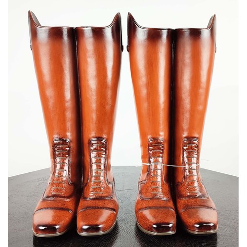 421 - STICK STANDS, a pair, faux riding boots design, painted resin, 48cm H each. (2)