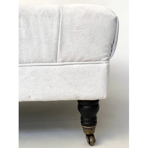 133 - BERKELEY OTTOMAN, rectangular off white cotton twill button upholstered with turned supports and cas... 