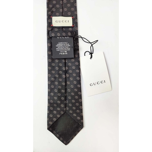 16 - GUCCI TIE, silk, with GG iconic pattern, 148cm x 7cm together with a pocket square/handkerchief, 45c... 