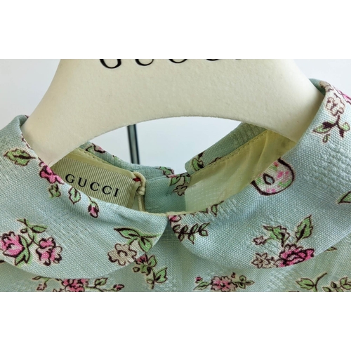 24 - GUCCI PROVANCE DRESS, size 36/4 Y, made in Italy, cotton, with dogs flower and masks print against p... 