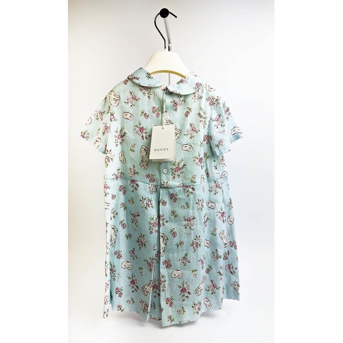 24 - GUCCI PROVANCE DRESS, size 36/4 Y, made in Italy, cotton, with dogs flower and masks print against p... 