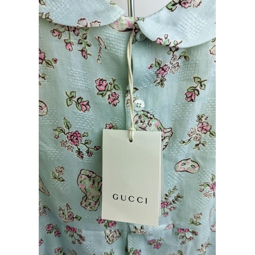 24 - GUCCI PROVANCE DRESS, size 36/4 Y, made in Italy, cotton, with dogs flower and masks print against p... 