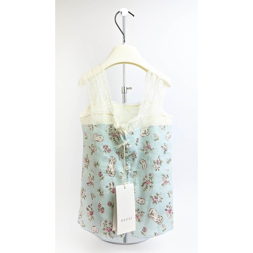 27 - GUCCI PROVANCE TOP, size 36/4 Y, made in Italy, linen with cotton lining, with dogs flower and masks... 