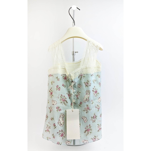 29 - GUCCI PROVANCE TOP, size 36/4 Y, made in Italy, linen with cotton lining, with dogs flower and masks... 