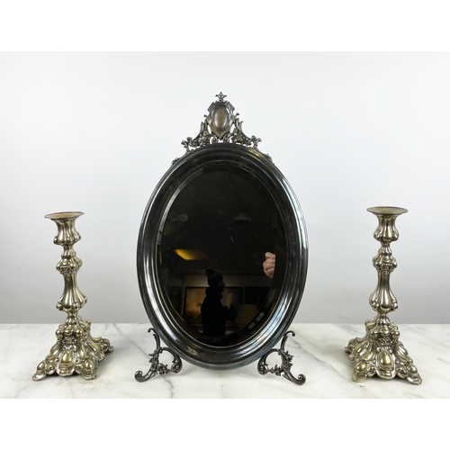 44 - OVAL DRESSING TABLE MIRROR, silver plated with bevelled plate and a pair of plated candlesticks, 31c... 