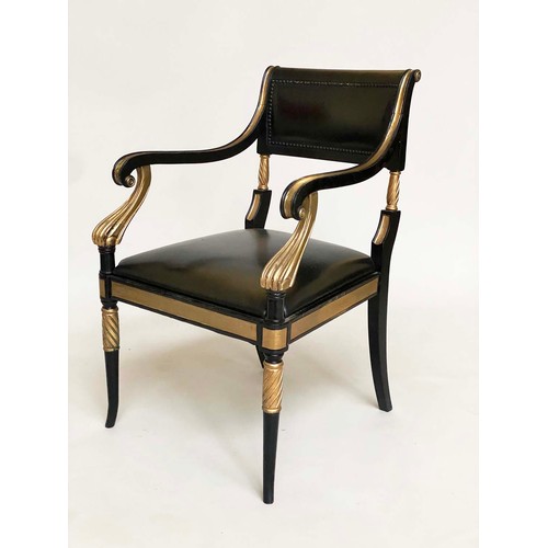 149 - ARMCHAIRS, a pair, Regency style lacquered and gilded with leather seats, scroll arms and swept supp... 