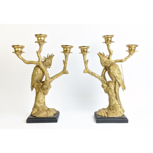 412 - FIGURAL CANDLESTICKS, in the form of cockatoos, gilt textured finish three branch form, black bases,... 