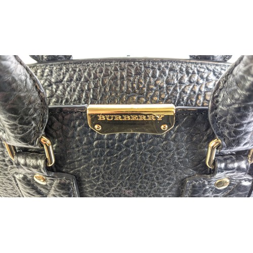 31 - BURBERRY HANDBAG, grained black leather, gold tone hardware and front plaque with logo, two handles,... 