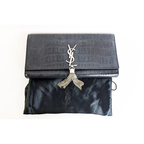 34 - YVES SAINT LAURENT CLUTCH, embossed leather body, metal iconic logo with tassel closure, front flap ... 